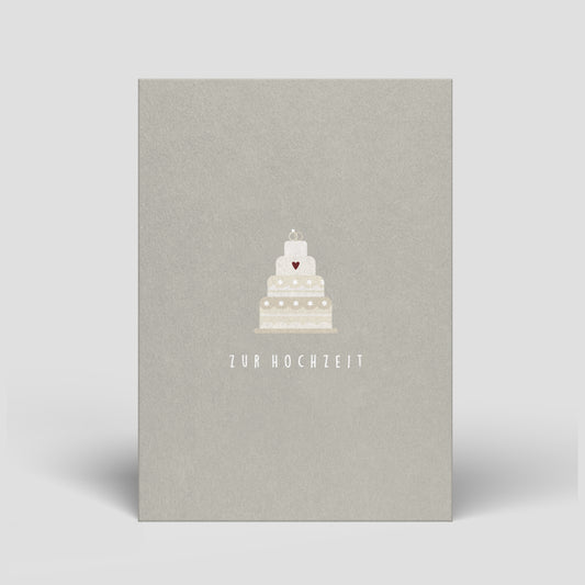 Graue Hochzeitskarte mit weißer Hochzeitstorte mit Herz und Schriftzug „zur Hochzeit“