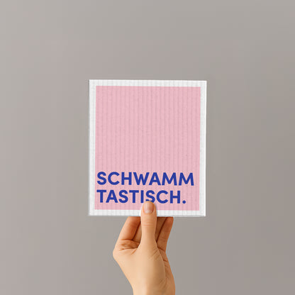 Rosa Schwammtuch mit blauem Spruch „SCHWAMM TASTISCH“