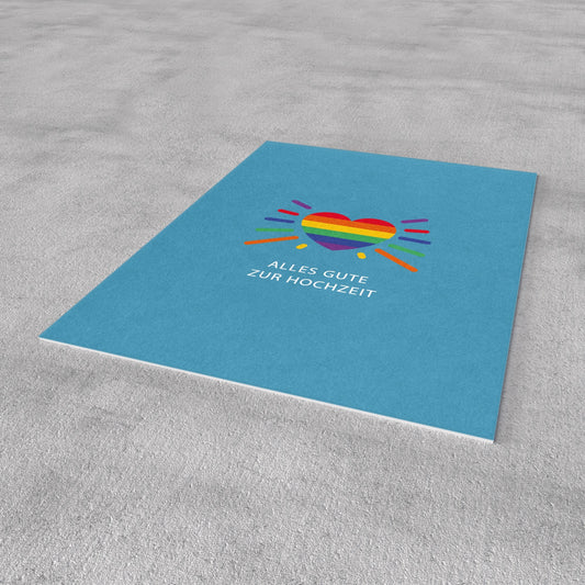 Postkarte in Blau mit Regenbogenherz und „Alles Gute zur Hochzeit“ mittig
